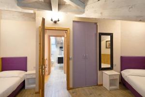 Postel nebo postele na pokoji v ubytování Chalet Picchio Quadrilocale