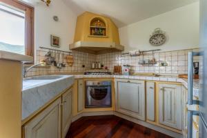 a kitchen with a sink and a dishwasher at Belvedere, House With Pool- Recco, Liguria 