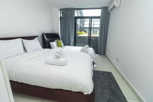 a bedroom with a large white bed with white pillows at Family 3 Bed Loft @Cantonments in Cantonments +85 photos