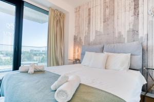 Postelja oz. postelje v sobi nastanitve Exquisite Serenity: One-Bedroom Oasis & Nice Views