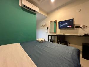 Ein Bett oder Betten in einem Zimmer der Unterkunft Darlene Hotel