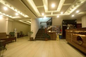 a large room with a staircase and a stair case at Hotel Lake Himalaya in Pokhara