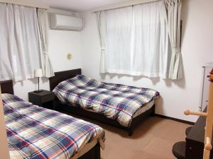 Postel nebo postele na pokoji v ubytování Hotel Yuni Star-Club