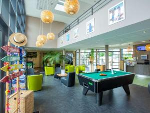 a pool table in the middle of a room at ibis Styles Bourges in Bourges