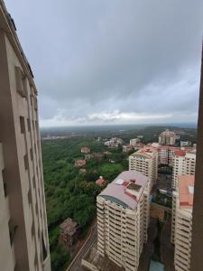 an aerial view of a city with tall buildings at Kshetra Manipal in Manipala