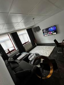 Televisyen dan/atau pusat hiburan di Schöne Wohnung in Bestlage inclusive Parkplatz