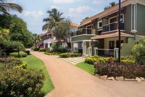 a walkway in front of a house at Radisson Blu Resort, Goa in Cavelossim