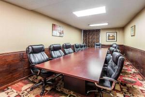 a conference room with a long table and leather chairs at Wingate by Wyndham Marietta Conference Center Ohio in Marietta