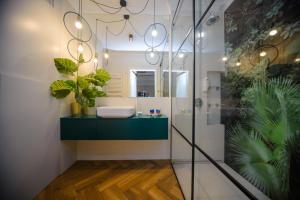 a bathroom with a sink and a mirror at Maya's Flats & Resorts 34 - Chmielna 73 in Gdańsk +37 photos
