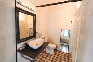 a bathroom with a sink and a toilet at Historical villa by the lake - 12 people in Doussard