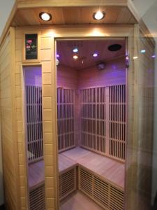 a sauna with a purple lighting in a room at 2 bd apartment with sauna in the center of Annecy in Annecy