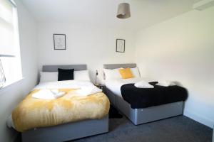 Postel nebo postele na pokoji v ubytování Deedes Apartment