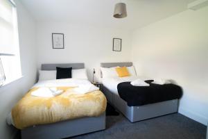 Katil atau katil-katil dalam bilik di Deedes Apartment