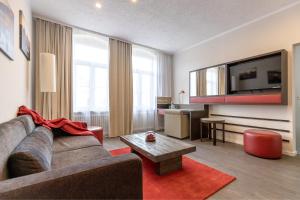 TV a/nebo společenská místnost v ubytování Hotel Garni " Am Domplatz"