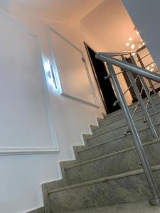 a set of stairs with a door in a building at Lovely 3 bedroom duplex in Ikeja GRA in Ikeja