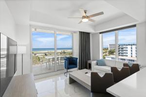 a living room with a view of the ocean at Ocean Club Treasure Island Hotel in St Pete Beach