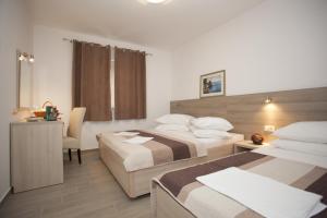 Posteľ alebo postele v izbe v ubytovaní Apartments Bota