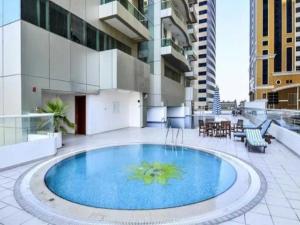 a large swimming pool on the roof of a building at luxury one bed room Apartment in dubai marina pinnacle tower in Dubai