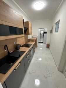 a kitchen with a sink and a counter top at Sunny House Three in Bratislava