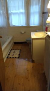 a bathroom with a sink and a tub and a toilet at Non-Smokers Only Private Room 6 with Kitchen Best Price for 1 Long-Term Guest 
