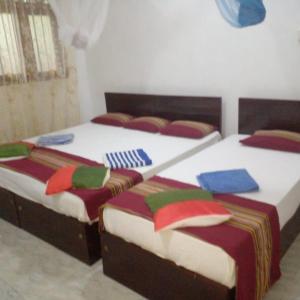 Ένα ή περισσότερα κρεβάτια σε δωμάτιο στο Star Home Stay Bentota