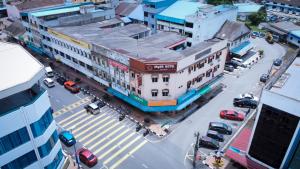an overhead view of a city street with cars and buildings at Myra Hotel Mersing in Mersing