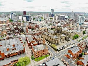 an aerial view of a city with buildings at Stunning Two Bed City Centre Apartment in Hunslet