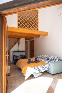 a bedroom with a bed and a loft bed at Charmant Bas de Villa au cœur de la Provence in Manosque