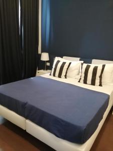 A bed or beds in a room at I DIOSCURI