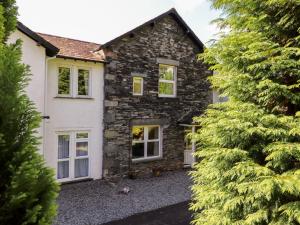 an exterior view of a stone house at Silver How in Ambleside
