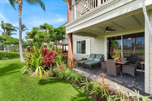 a patio with a table and chairs on a house at Waikoloa Beach Villas L3 in Waikoloa