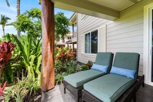 a porch with a chair on a house at Waikoloa Beach Villas L3 in Waikoloa