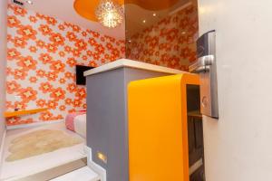 a childs room with a yellow and blue refrigerator at OYO 902 Rooms Boutique Hotel in Johor Bahru