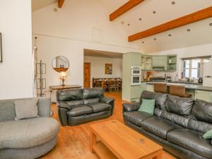 A seating area at The Coach House at Plas Dolguog