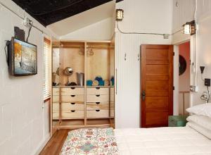 a bedroom with a bed and a dresser at Folly Vacation 114B Townhouse, perfect family vacation, pets welcome! in Folly Beach