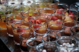 a bunch of glasses with fruit in them on a table at Prinsotel La Dorada & Spa in Playa de Muro