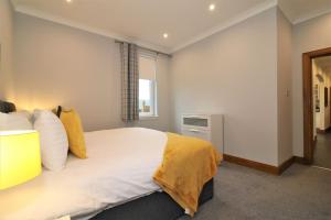 Cama ou camas em um quarto em Greenlees Clubhouse 3 Bed