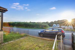 a car parked on the side of a road at Sweet Home with Backyard in Howden-le-Wear for 3 in Crook