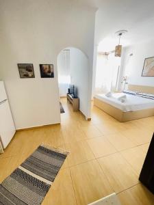 a bathroom with a tub and a sink in a room at Mediterranean Sea Apartments in Durrës