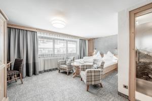 Postel nebo postele na pokoji v ubytování Hotel Jenewein + 21 fotografií