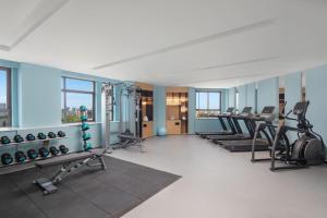 a gym with a row of treadmills and machines at Fairfield by Marriott Kunshan in Kunshan