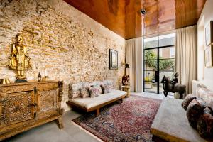 Postel nebo postele na pokoji v ubytování Boutique Hotel Goud En Zilver + 37 fotografií