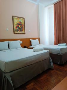 Postel nebo postele na pokoji v ubytování Hotel Atlântico Tower + 32 fotografií