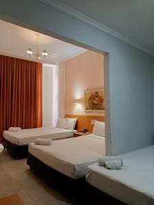 Кровать или кровати в номере Hotel Atlântico Tower