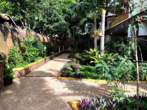 A garden outside Alona Park Residence - 3 bedroom apartment- alex and jesa unit