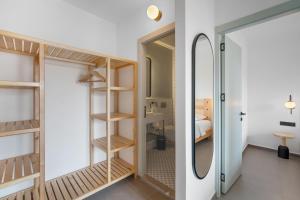 a room with a mirror and a bedroom at EGEDEN HOTEL in Datca +32 photos