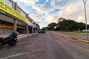 a motorcycle parked on the side of a street at Asa Norte, Brasília - NOR in Brasilia