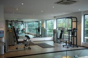 a gym with several treadmills and elliptical machines at Blue Sky 2 Bed At Cantonments in Cantonments