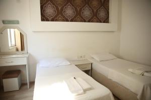 Postel nebo postele na pokoji v ubytování SARAY APART OTEL