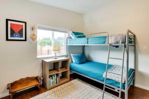 a bedroom with two bunk beds and a window at Serene Sequim Retreat with Deck Pets Welcome! in Sequim